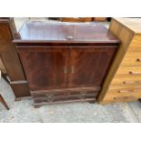 A MAHOGANY CABINET