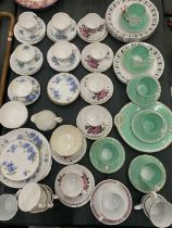 A LARGE QUANTITY OF VINTAGE TEA WARE TO INCLUDE CHINA TRIOS, ADDERLEY 'CORNFLOWER' CUP, SAUCERS,