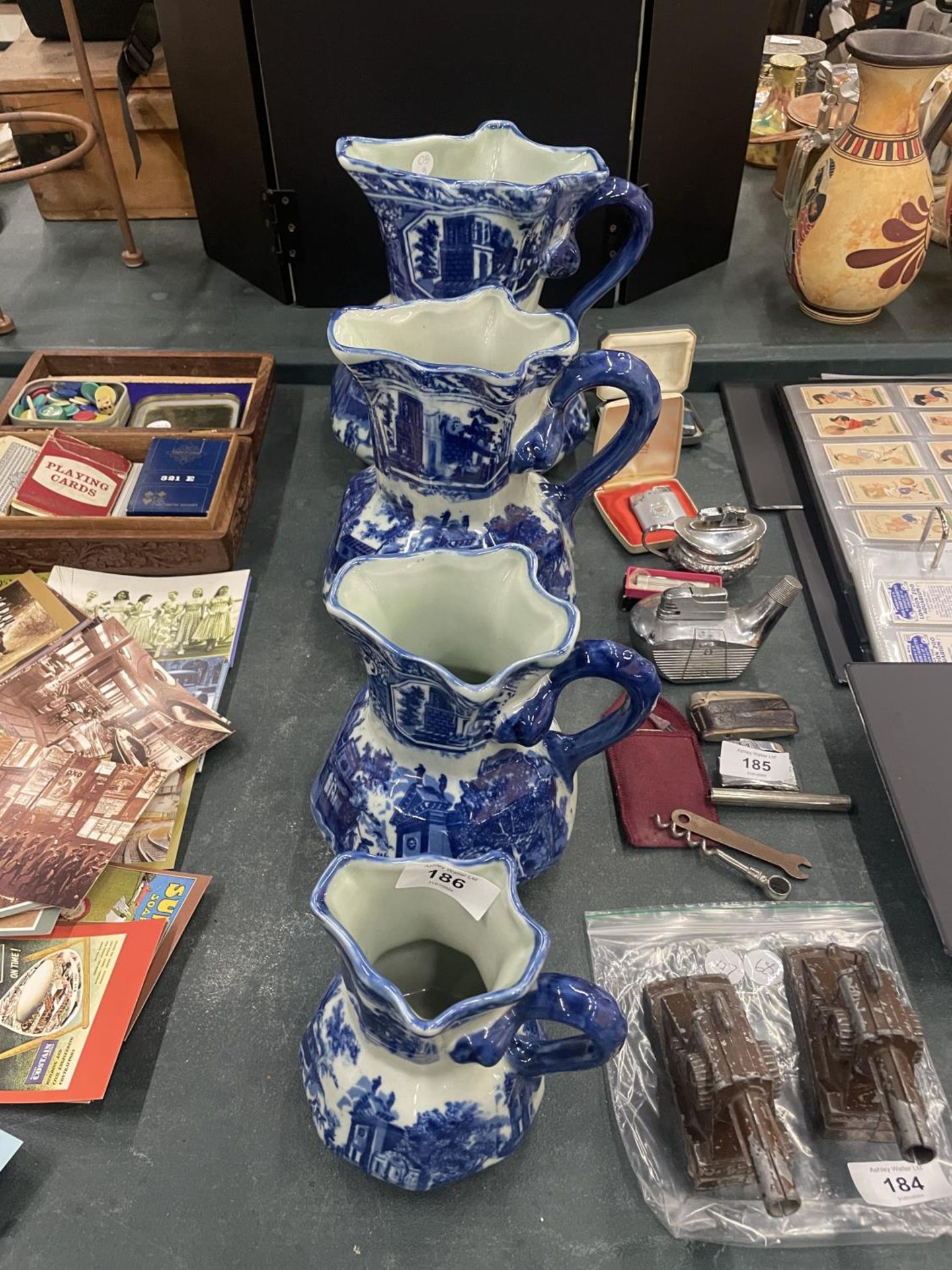 FOUR MATCHING, GRADUATING BLUE AND WHITE IRONSTONE JUGS, LARGEST HEIGHT 23CM