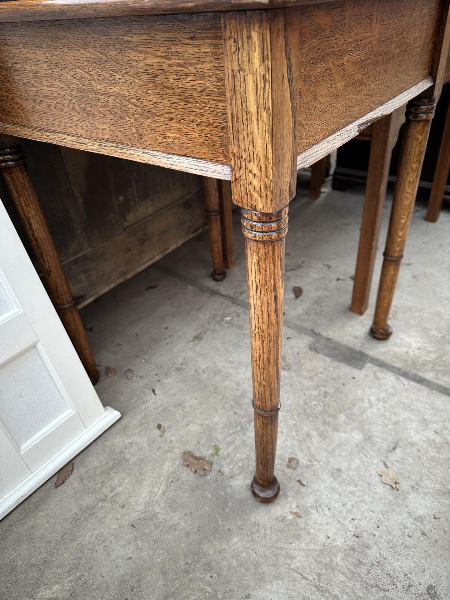 AN EARLY 20TH CENTURY OAK CENTRE TABLE ON TURNED AND TAPERED SUPPORTS - 23" SQUARE - Image 3 of 3