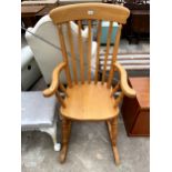 A VICTORIAN STYLE BEECH LATH BACK ROCKING CHAIR