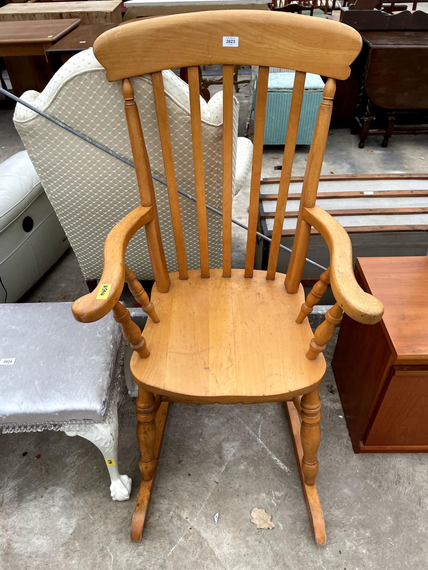 A VICTORIAN STYLE BEECH LATH BACK ROCKING CHAIR