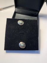 A PAIR OF GREENSTONE CUFFLINKS IN A PRESENTATION BOX