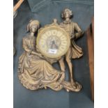 A LARGE GOLD COLOURED LORD AND LADY ROMAM WALL CLOCK, 20 INCH X 14 INCH