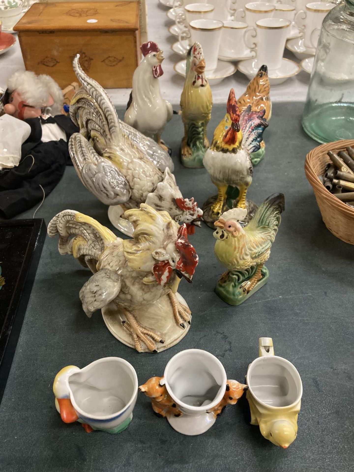 A COLLECTION OF CERAMIC ROOSTER FIGURES