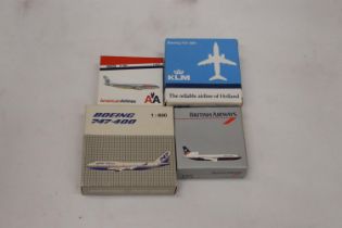 FOUR BOXED MODEL AEROPLANES