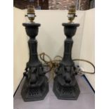 A PAIR OF BLACK CERAMIC LAMPS WITH DOUBLE SPHINX DESIGN