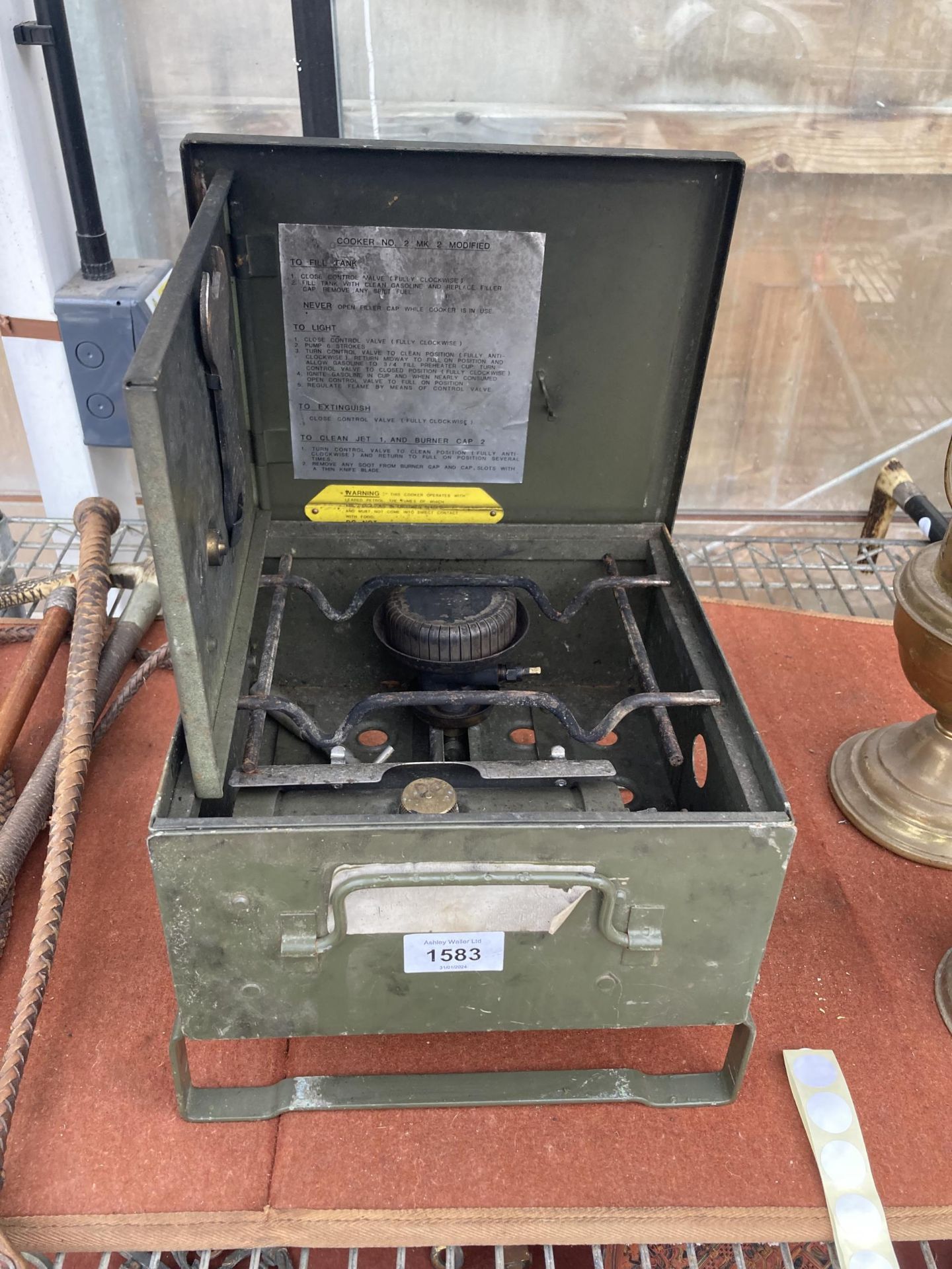 A VINTAGE MILITARY FOLDING COOKING STOVE