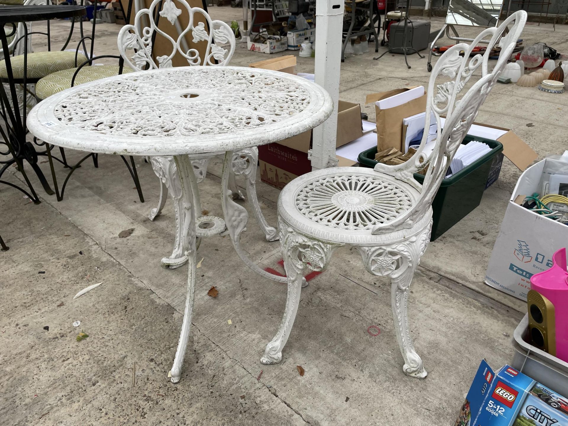 A VINTAGE CAST ALLOY BISTRO SET COMPRISING OF A ROUND TABLE AND TWO CHAIRS - Image 2 of 2