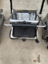 A STAINKLESS STEEL PARRY GRILLING MACHINE