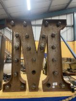 A GIANT FAIRGROUND METAL LIGHT UP LETTER M, 24 INCH X 21INCH