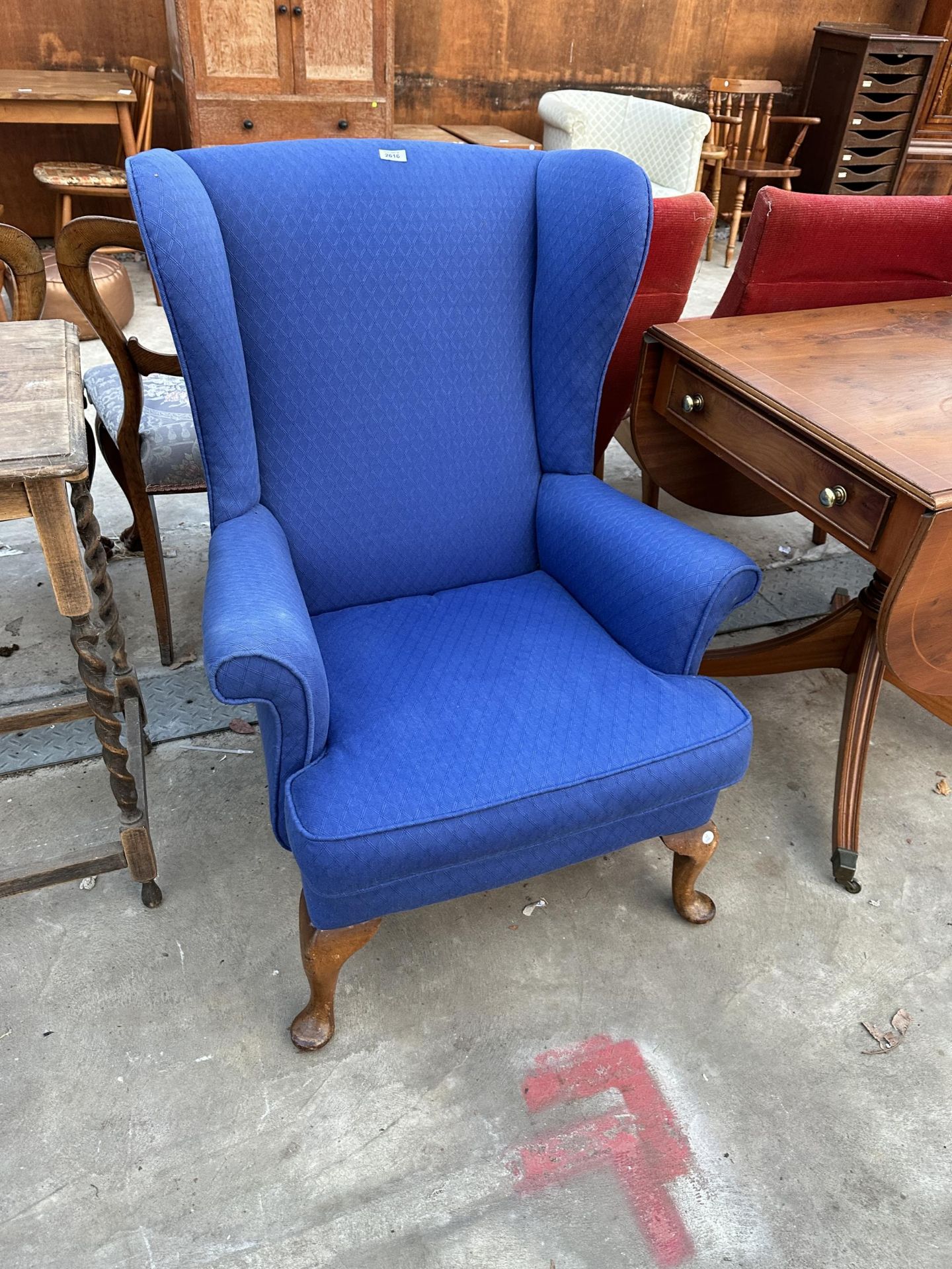A PARKER KNOLL WINGED FIRESIDE CHAIR MODEL NO. PK. 720/2