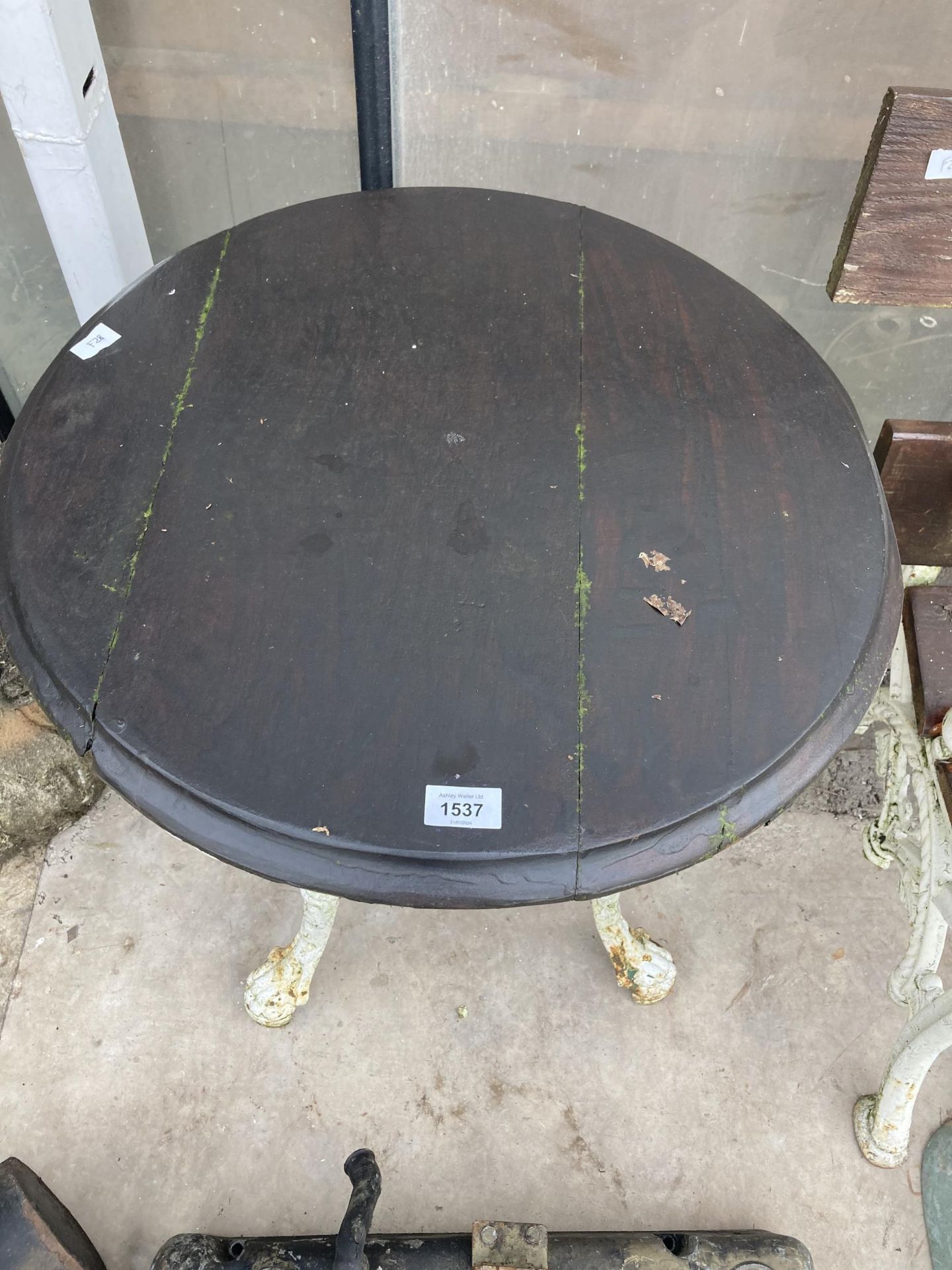 A VINTAGE PUB TABLE WITH CAST IRON BASE AND WOODEN TOP - Image 2 of 3