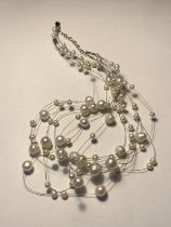 A SILVER AND PEARL NECKLACE