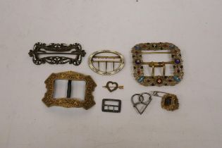 A COLLECTION OF VINTAGE METAL AND ENAMEL BELT BUCKLES