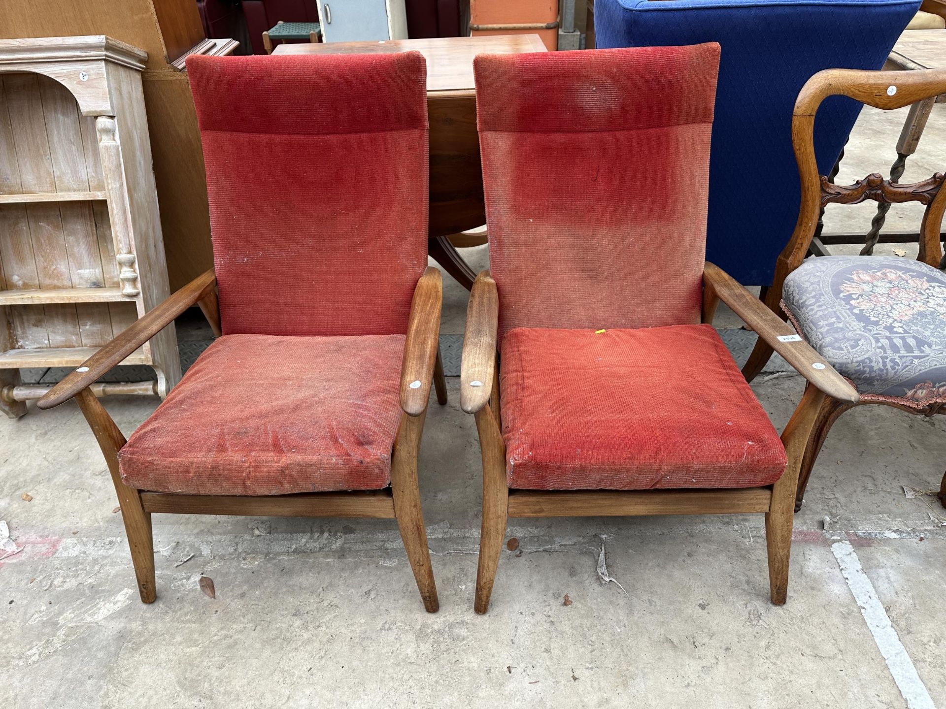 A PAIR OF FURPRO BY PIRELLI RETRO TEAK ARMCHAIRS