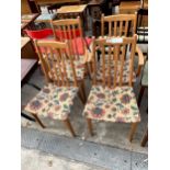 A SET OF FOUR MODERN DINING CHAIRS, TWO BEING CARVERS