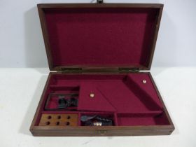 A WOODEN BOX FITTED OUT FOR A 28CM WIDE PISTOL, WIDTH OF BOX 30CM, DEPTH 18CM, HEIGHT 6CM
