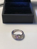 A SILVER AND AMETHYST RING IN A PRESENTATION BOX