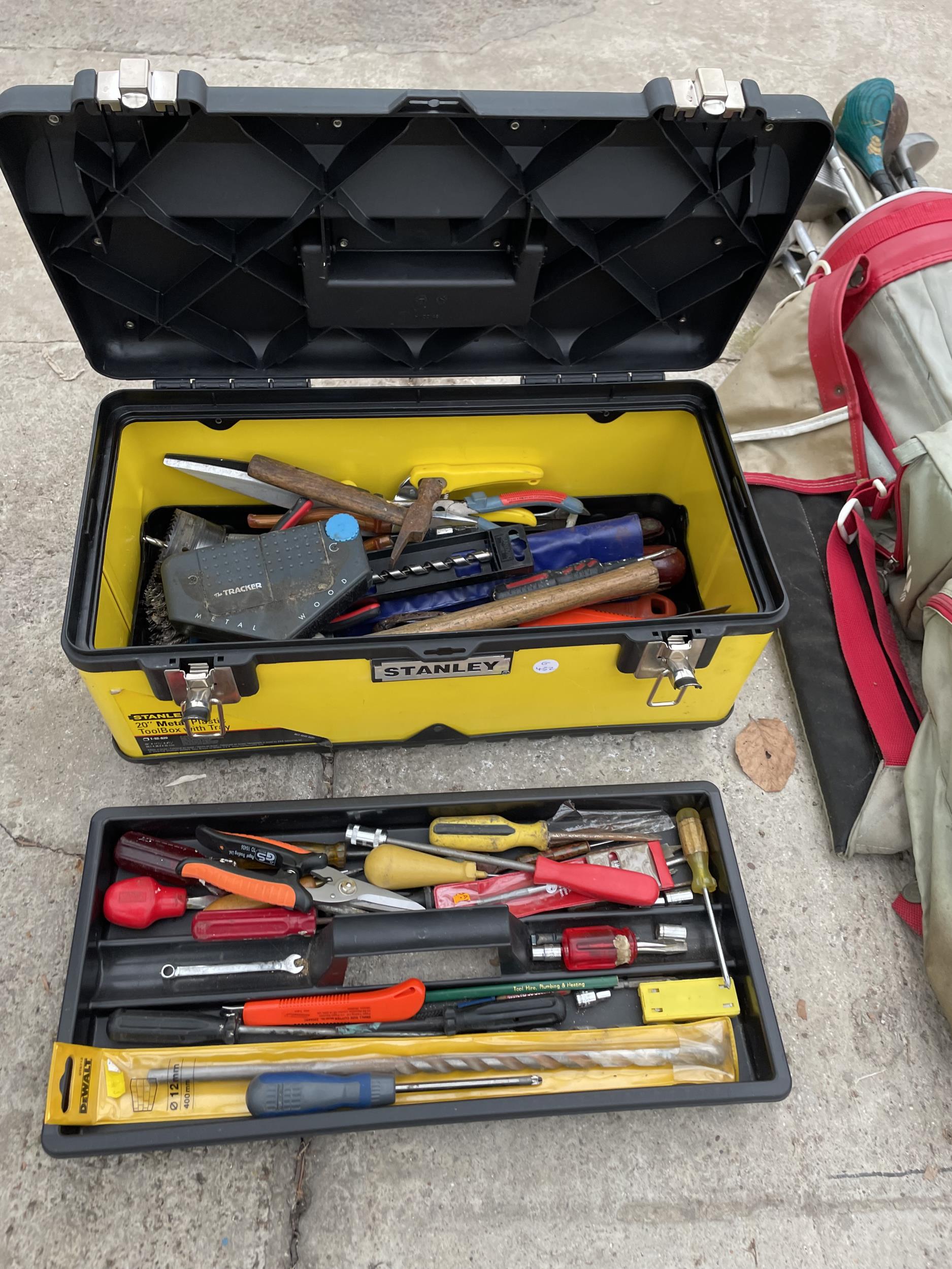 A STANLEY TOOL BOX WITH AN ASSORTMENT OF TOOLS TO INCLUDE AN AXE, SCREW DRIVERS AND PLIERS ETC