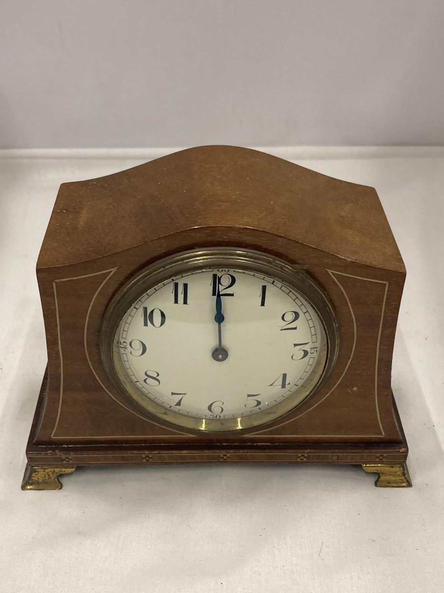 A SWISS MADE INLAID MANTLE CLOCK SEEN WORKING BUT NO WARRANTY