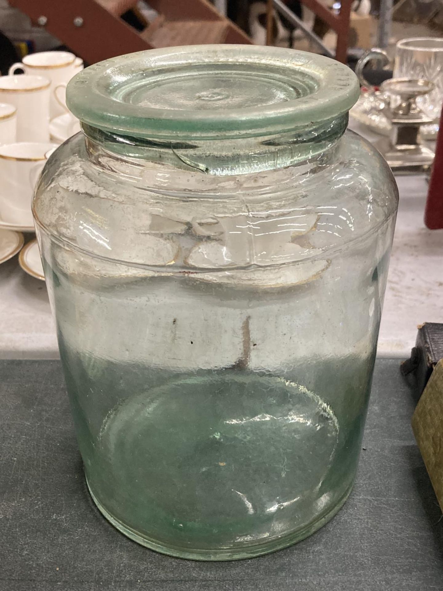 A VINTAGE NUTTALL & CO GLASS JAR WITH LID