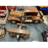 A LARGE WOODEN MODEL OF A CAR PLUS A SMALLER MODEL OF A BI-PLANE