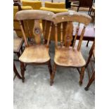 A PAIR OF VICTORIAN ELM AND BEECH KITCHEN CHAIRS WITH BULLSEYE BACKS