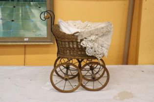 A VICTORIAN CHILD'S PRAM WITH LACE COVERS