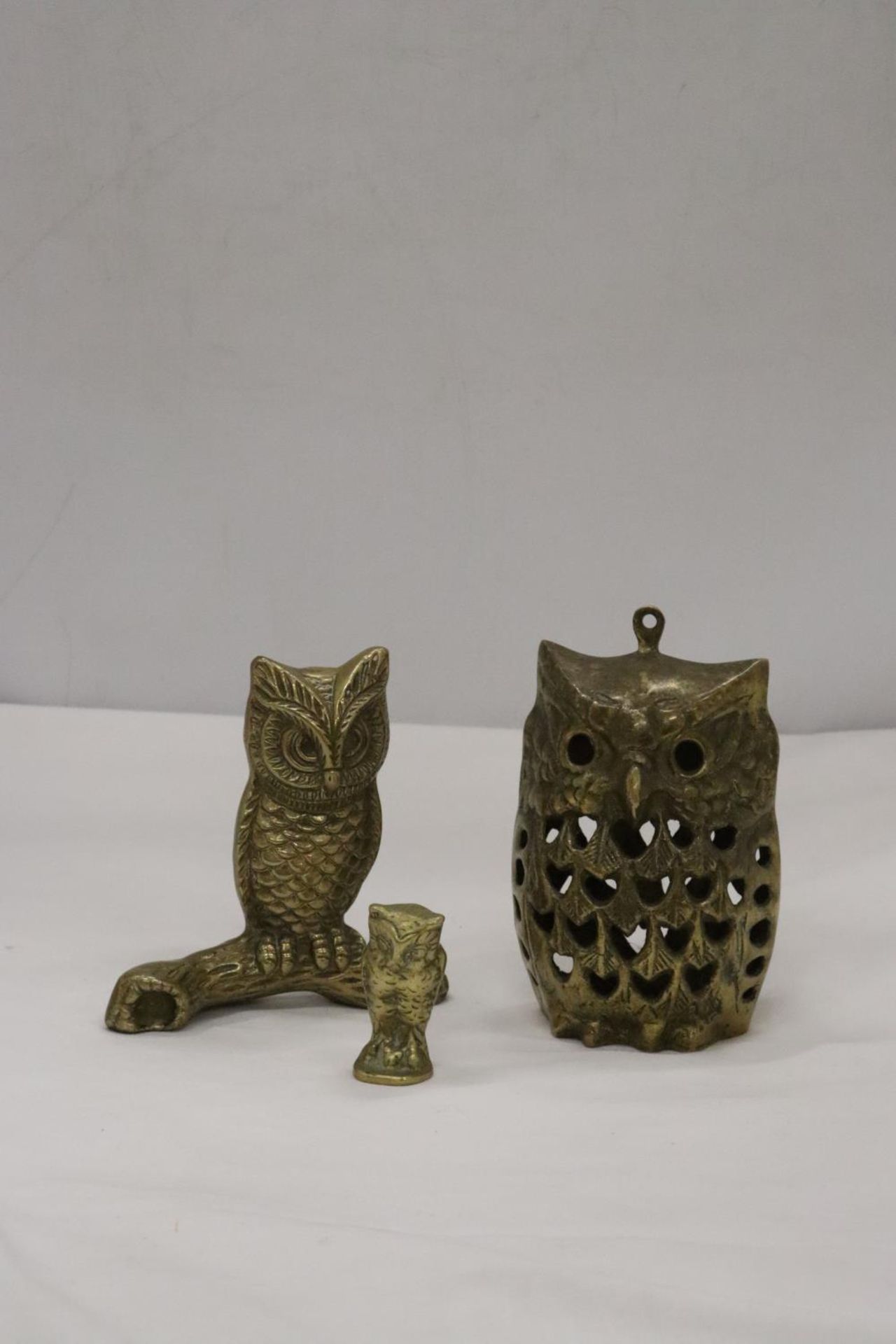 THREE BRASS OWLS, LARGEST 13CM