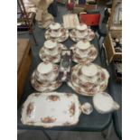 A QUANTITY OF ROYAL ALBERT 'OLD COOUNTRY ROSES' TO INCLUDE A SANDWICH PLATE, CUPS, SAUCERS, SIDE