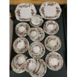A VINTAGE FLORAL PATTERNED PART TEASET TO INCLUDE CAKE PLATES, CREAM JUG, SUGAR BOWL, CUPS,