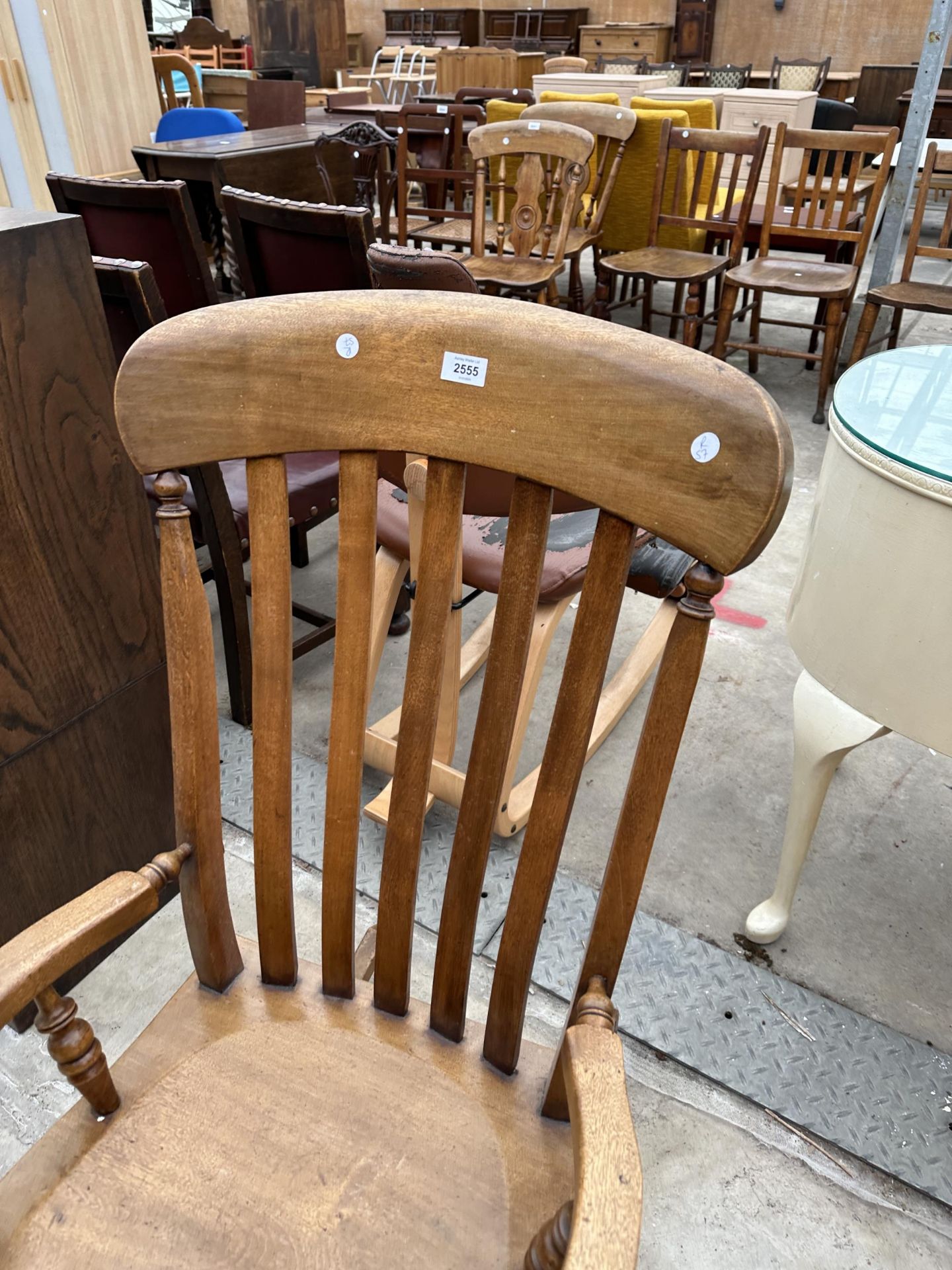 A VICTORIAN STYLE ELM AND BEECH LATH BACK ROCKING CHAIR - Image 2 of 3