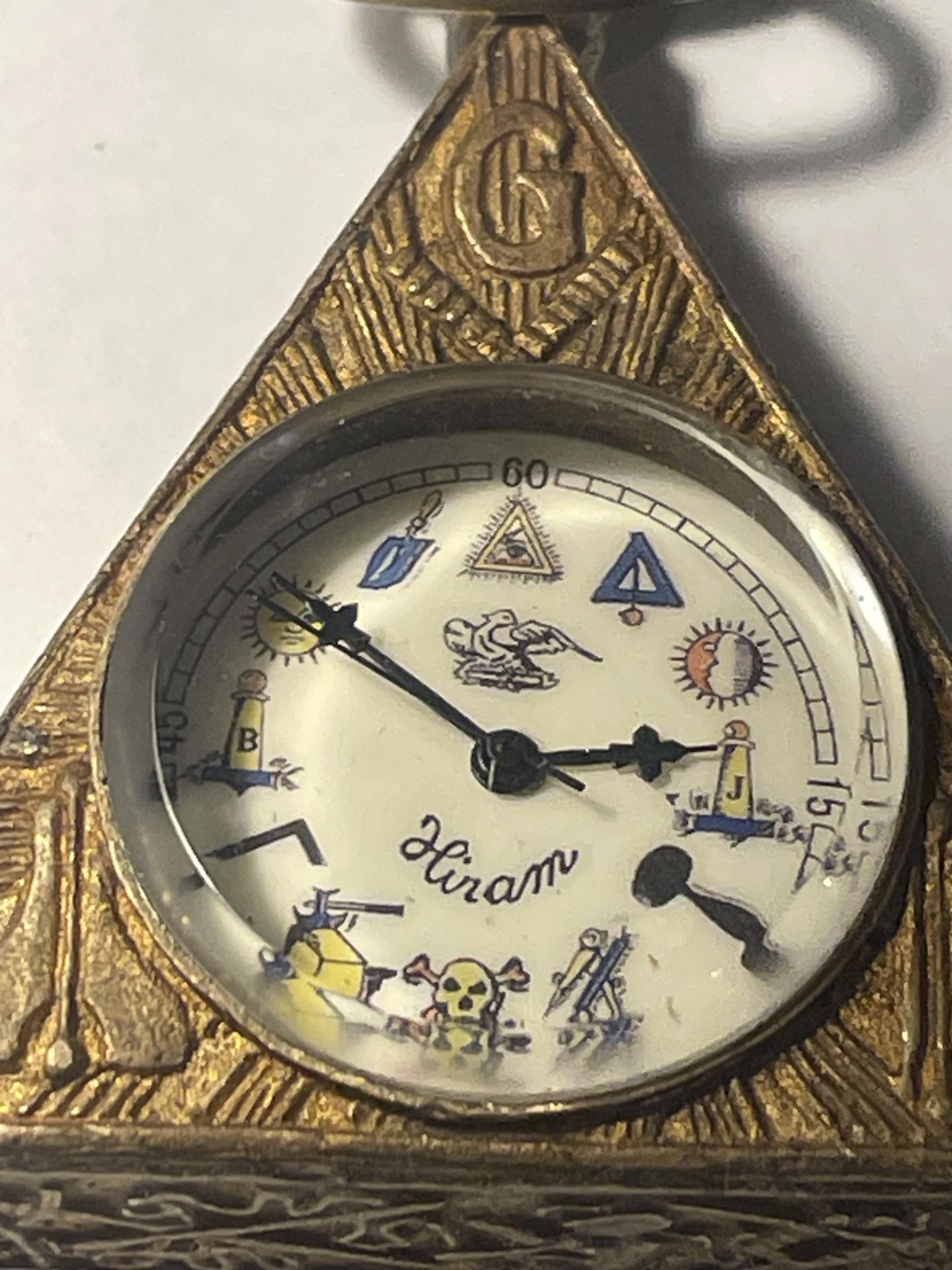 A BRONZE MASONIC TRIANGULAR SHAPED WATCH - Image 4 of 4