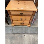 A MODERN PINE BEDSIDE CHEST OF THREE DRAWERS