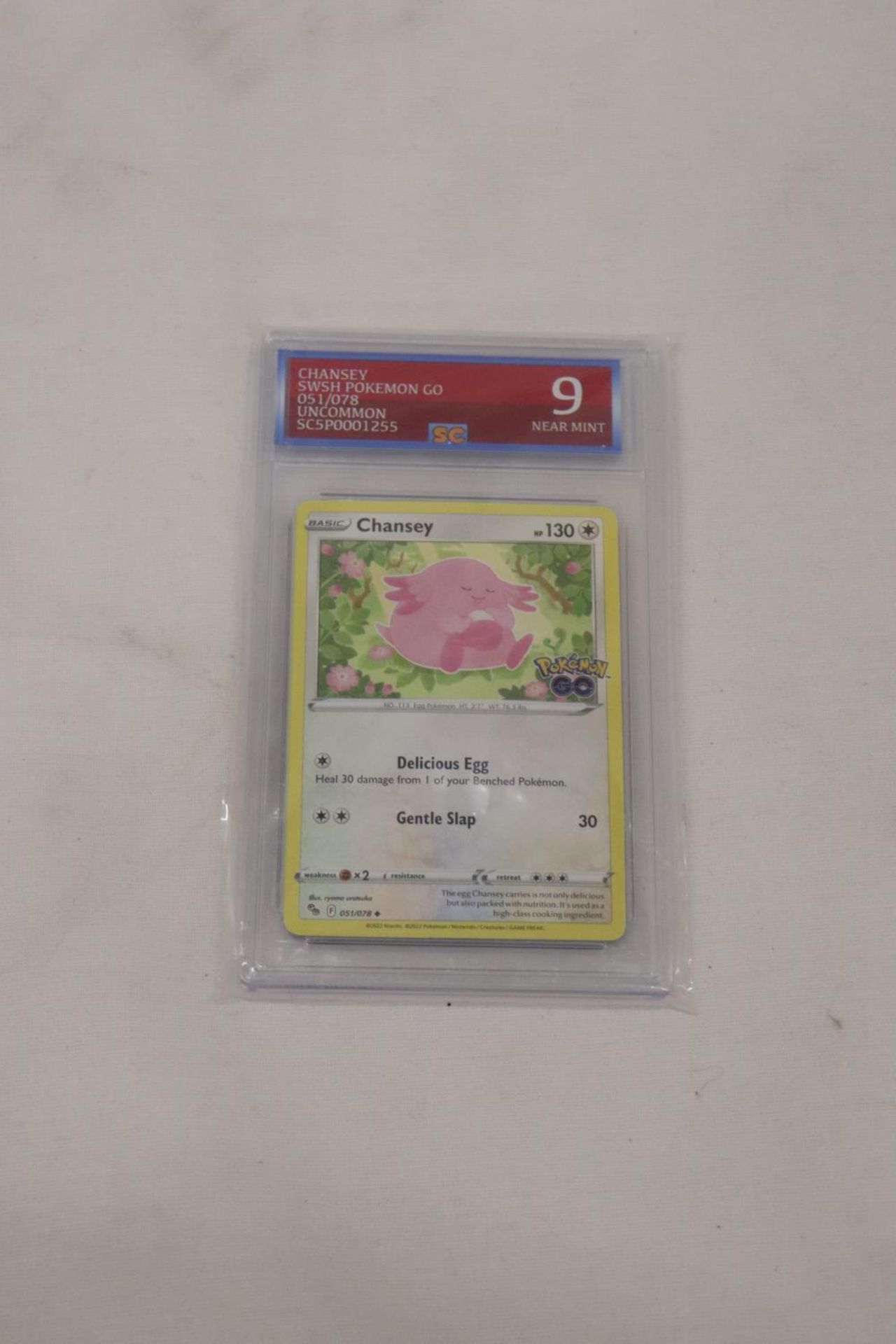 A CHANSEY POKEMON CARD, GRADED NUMBER 9, NEAR MINT