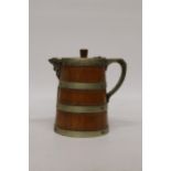 AN OAK AND SILVER PLATED BANDED ICE WATER JUG - 23CM (H)