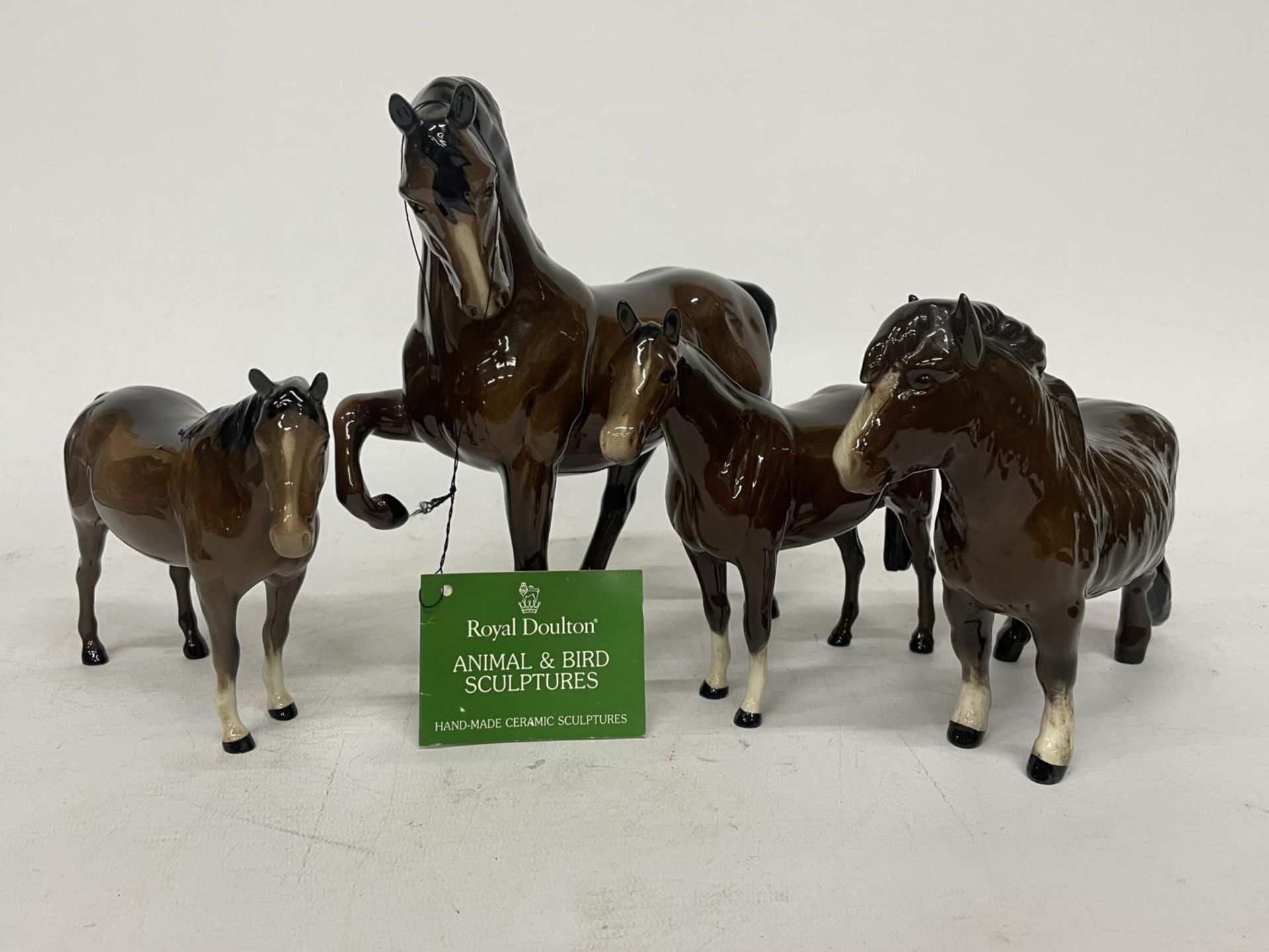 FOUR ROYAL DOULTON BROWN GLOSS HORSES