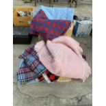 A LARGE QUANTITY OF ASSORTED BLANKETS