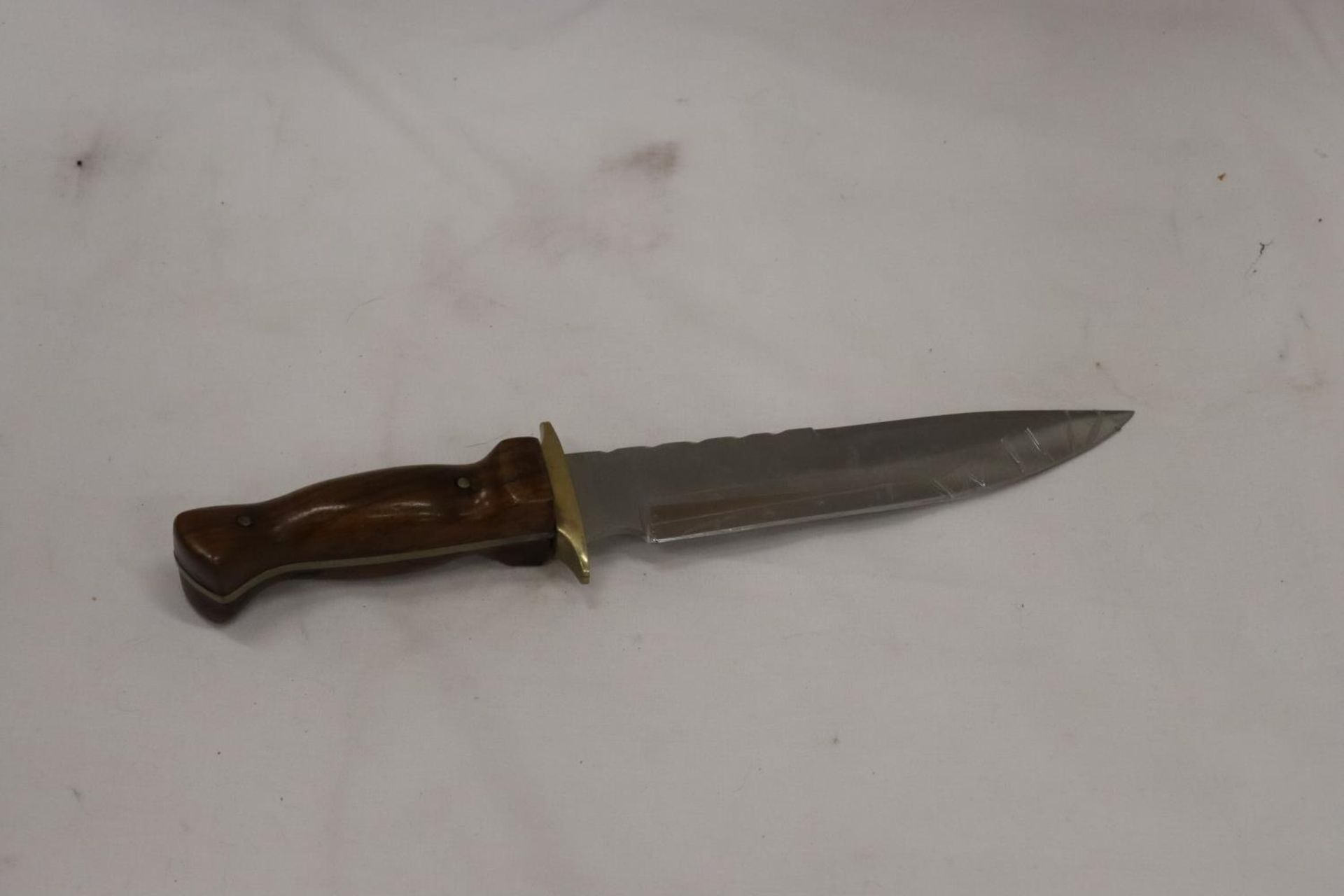 A HANDMADE DAGGER WITH WOODEN HANDLE