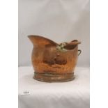 A VINTAGE HAMMERED COPPER COAL SCUTTLE