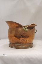 A VINTAGE HAMMERED COPPER COAL SCUTTLE