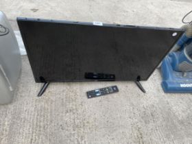 A JVC 32" TELEVISION WITH REMOTE CONTROL