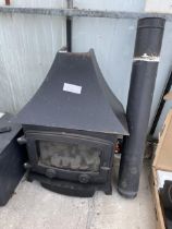 A CAST IRON LOG BURNER WITH FLU