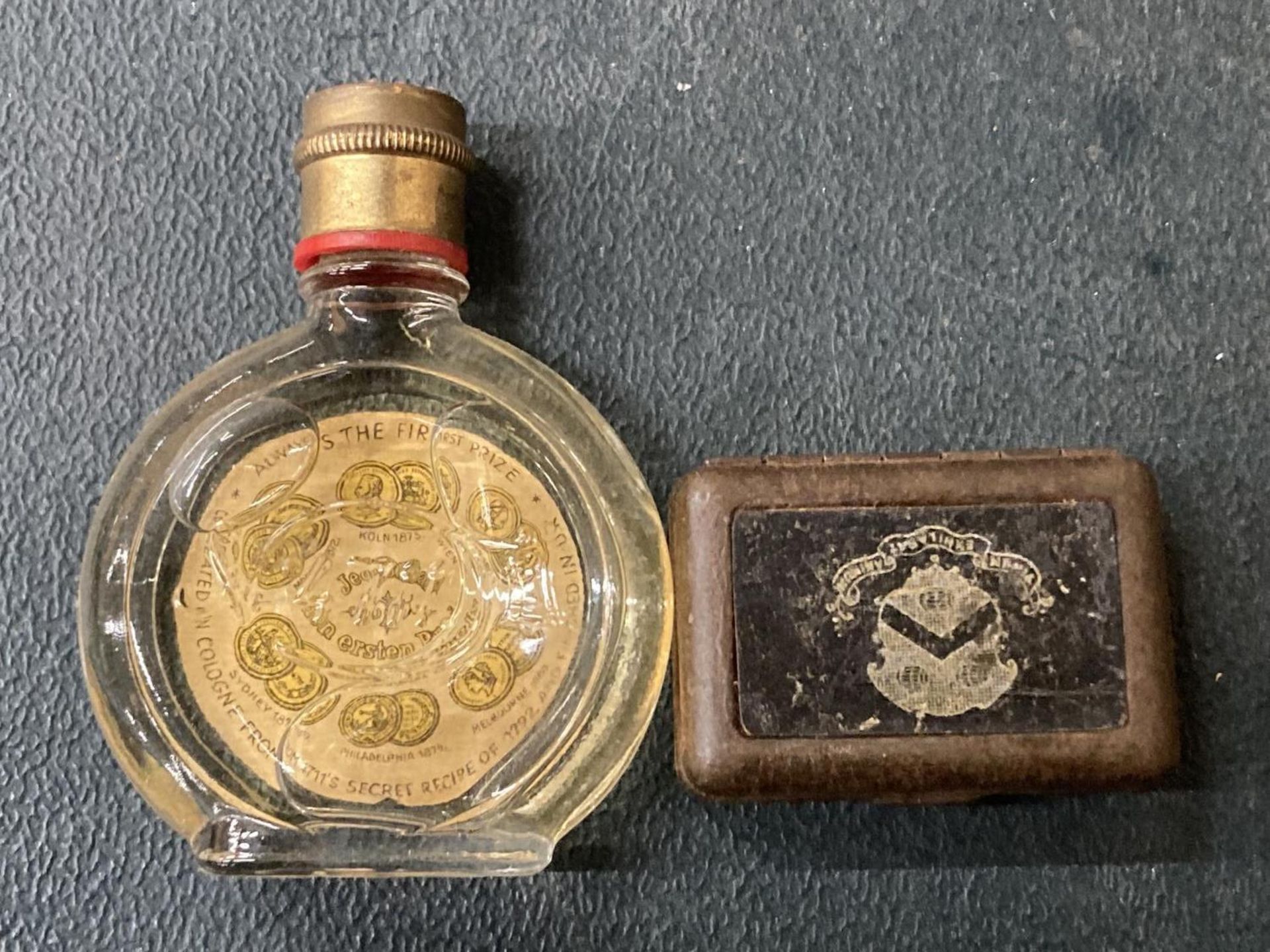 A VINTAGE BLUE AND GOLD EAU DE COLOGNE AND A TIN OF MATCHES - Image 2 of 2