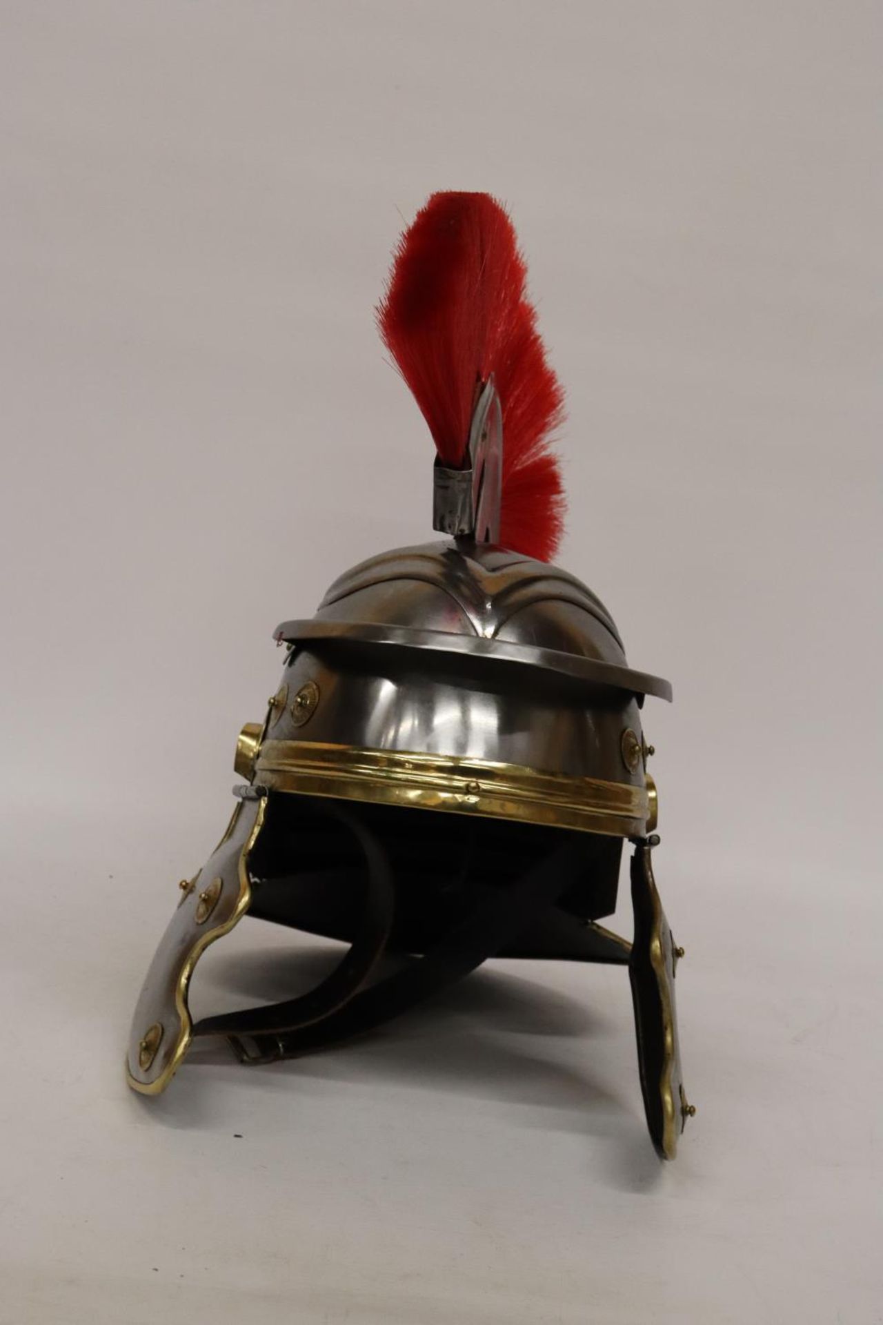 A REPRODUCTION ROMAN HELMET