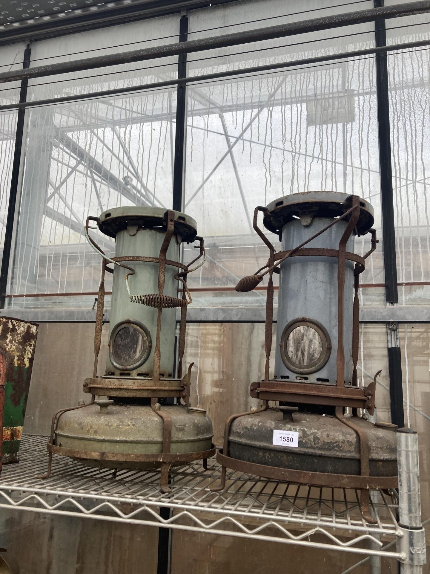 A PAIR OF VINTAGE PARAFIN GREENHOUSE HEATERS