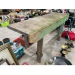 A WOODEN TWO TIER POTTING BENCH