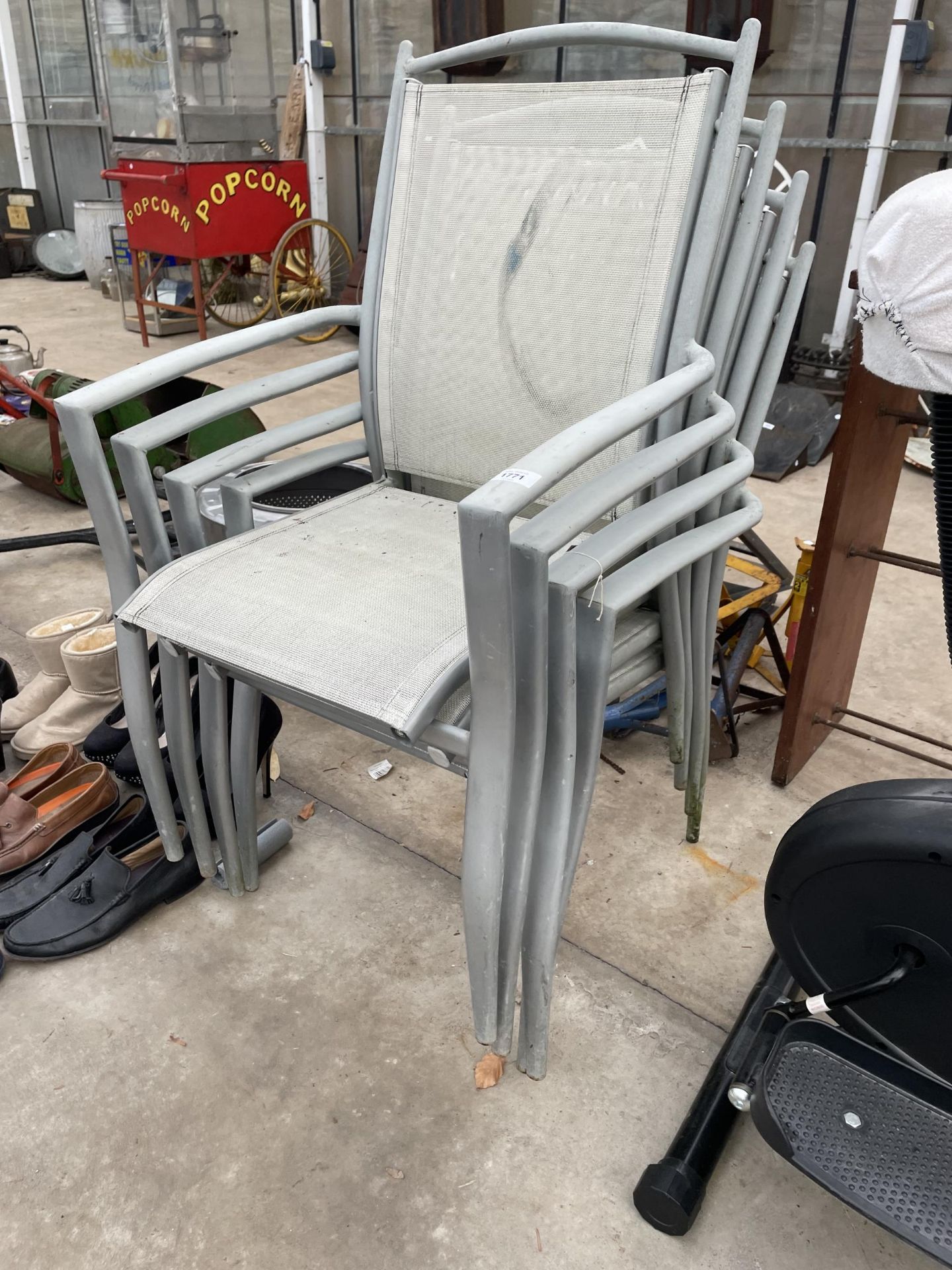 FOUR METAL FRAMED STACKING GARDEN CHAIRS