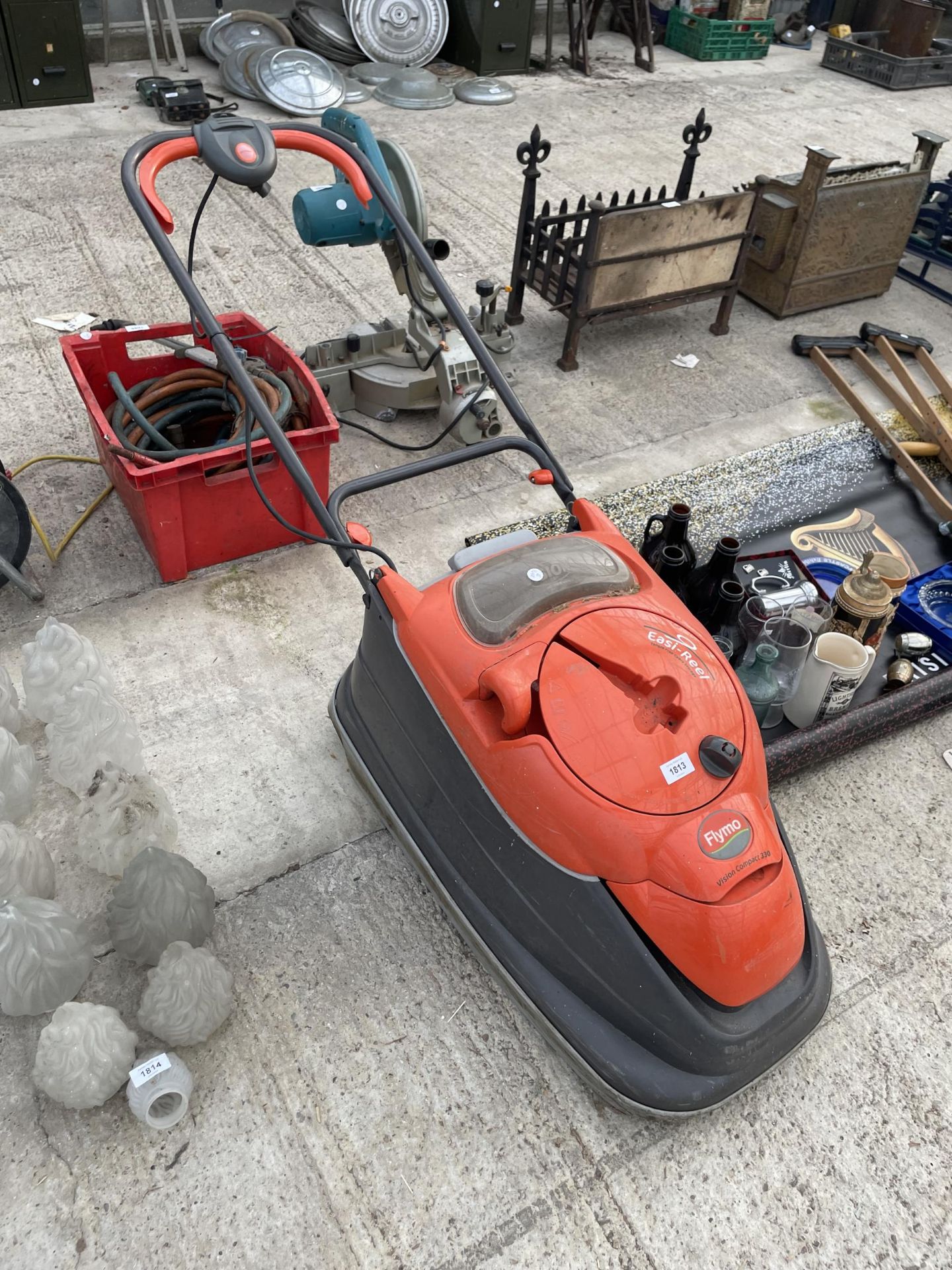 AN ELECTRIC FLYMO EASI-REEL LAWN MOWER